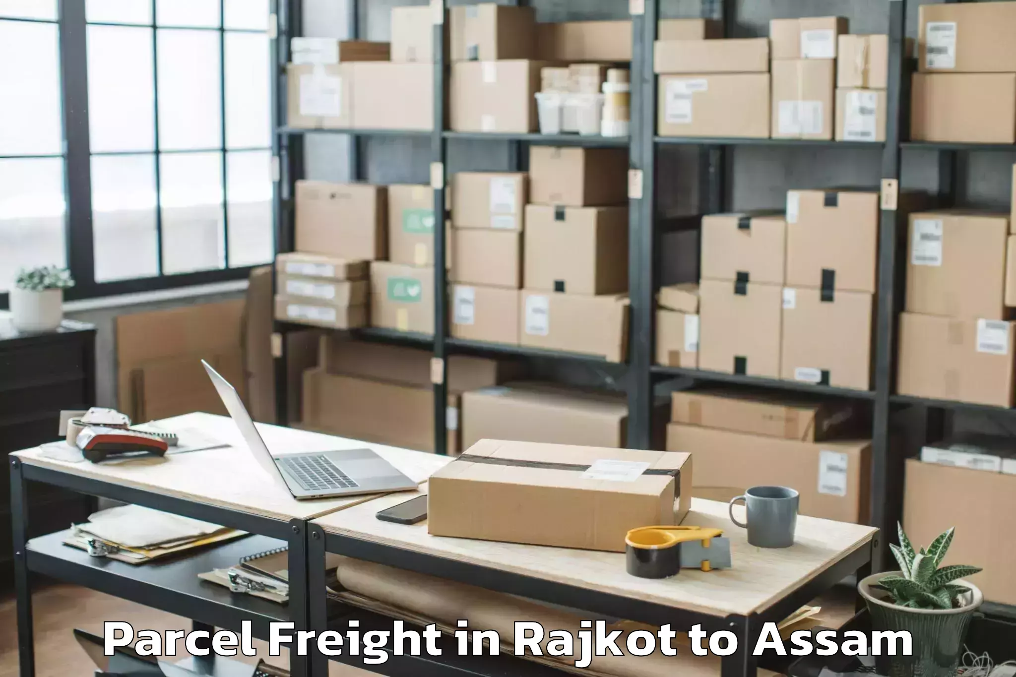 Easy Rajkot to Dum Duma Parcel Freight Booking